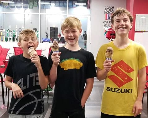 Kids posing with ice cream.